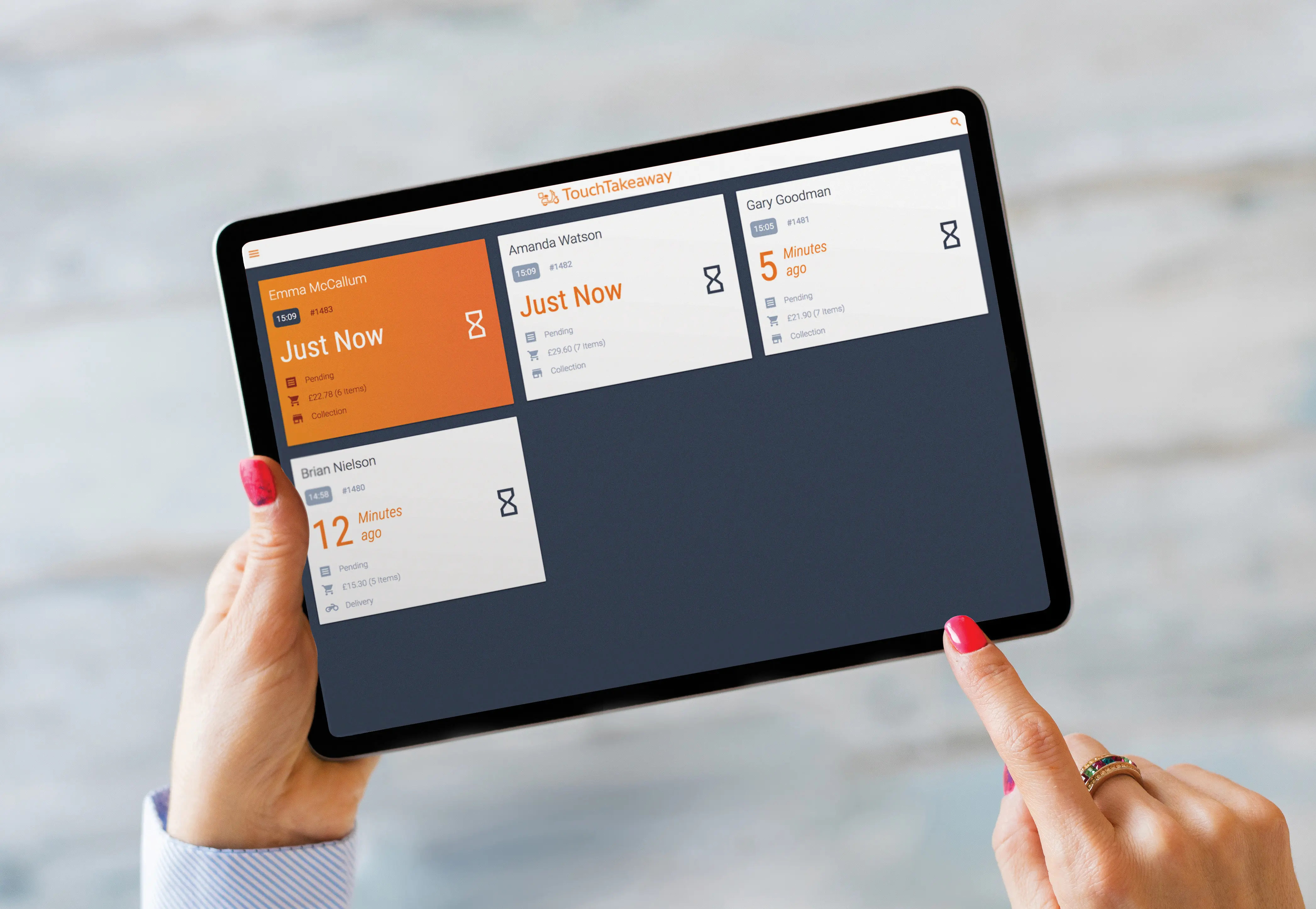 Staff managing delivery operations with TouchTakeaway Commander